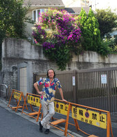 Patrick Blanc under an old Tibouchina granulosa in full bloom on Omote Sando, Tokyo, Sept. 2015