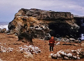 Patrick Blanc walking on the rocky coast, Saint Palais, France, Aug. 1957