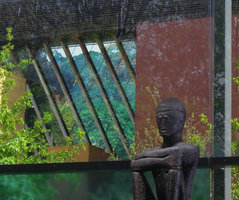 Quai Branly Museum, translucent façade with  photo by Patrick Blanc of the Cameroun rain forest canopy with the young red leaves of Desbordesia glaucesscens