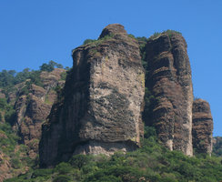 Sandstone peaks partially covered with plants, el Tepozteco, Cuarnavaca, Mexico