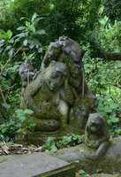 Stone and living monkeys, Ubud, Bali