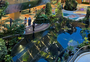 Transparent glass covering the water in the Dreamscape Garden at Changi T2, similar to the Christarium in Patrick Blanc Home