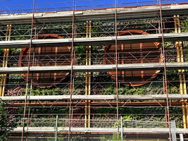 Two circular aerations included in the vertical garden, Oiken electric station, Sion, June 2026