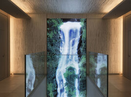 Universe of Water Particles, the digital waterfall by TeamLab integrating the photos of plants by Patrick Blanc, just as a mirror of his opposite vertical garden, Ginza Six, Tokyo