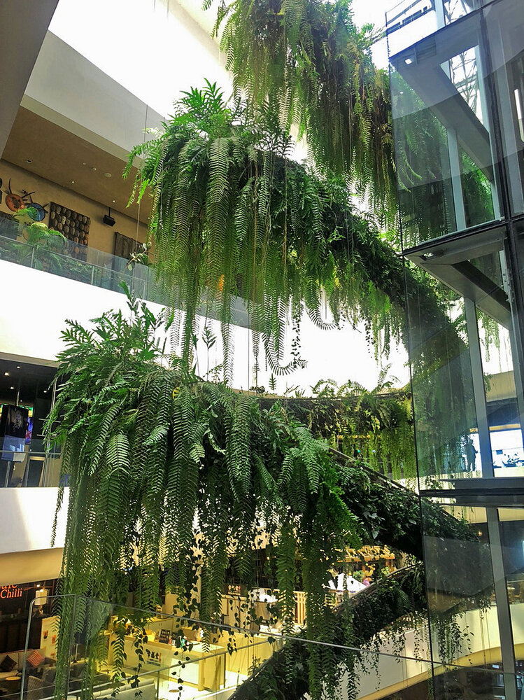 Green vertical interior design of Emquartier shopping mall dining